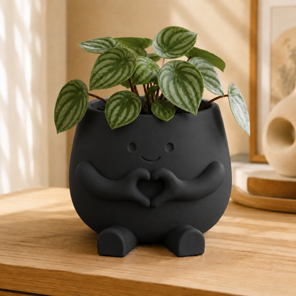 Vaso amiguinho com carinha sorridente e mãos fazendo coração, na cor preta