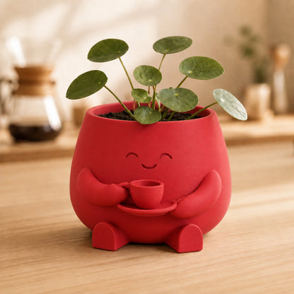 Vaso amiguinho segurando uma xícara com as duas mãos, na cor vermelha